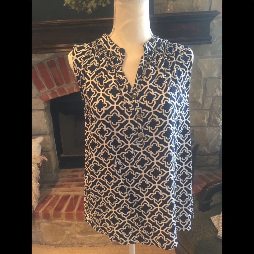 Classic blue and white sleeveless button up top.